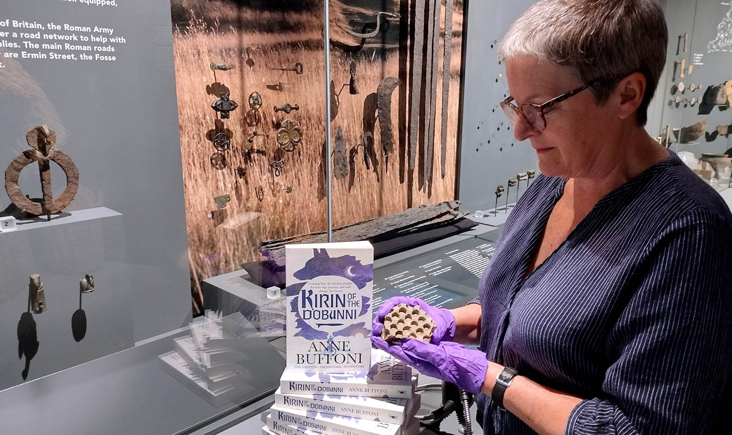 Anne Buffoni with an Iron Age coin mould from Bagendon